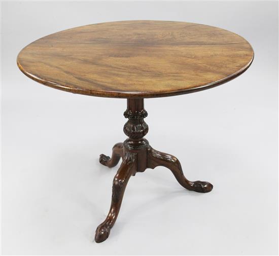 A George III circular mahogany tripod table, W.2ft 10.5in.